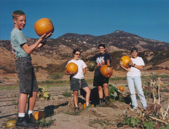 Castile Canyon Scientology School, students showing pumpkins in the field