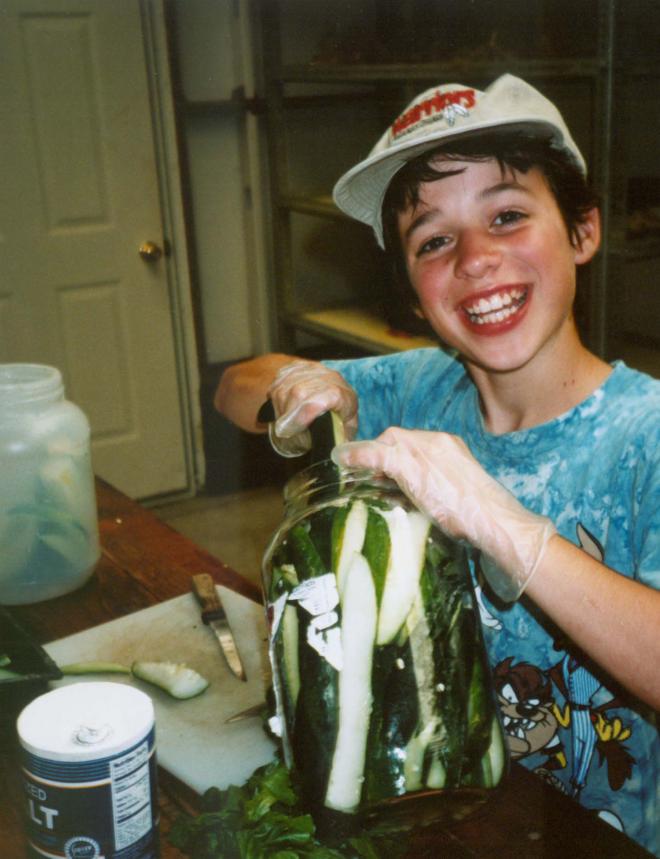 Castile Canyon Scientology School, smiling boy student preparing pickles 